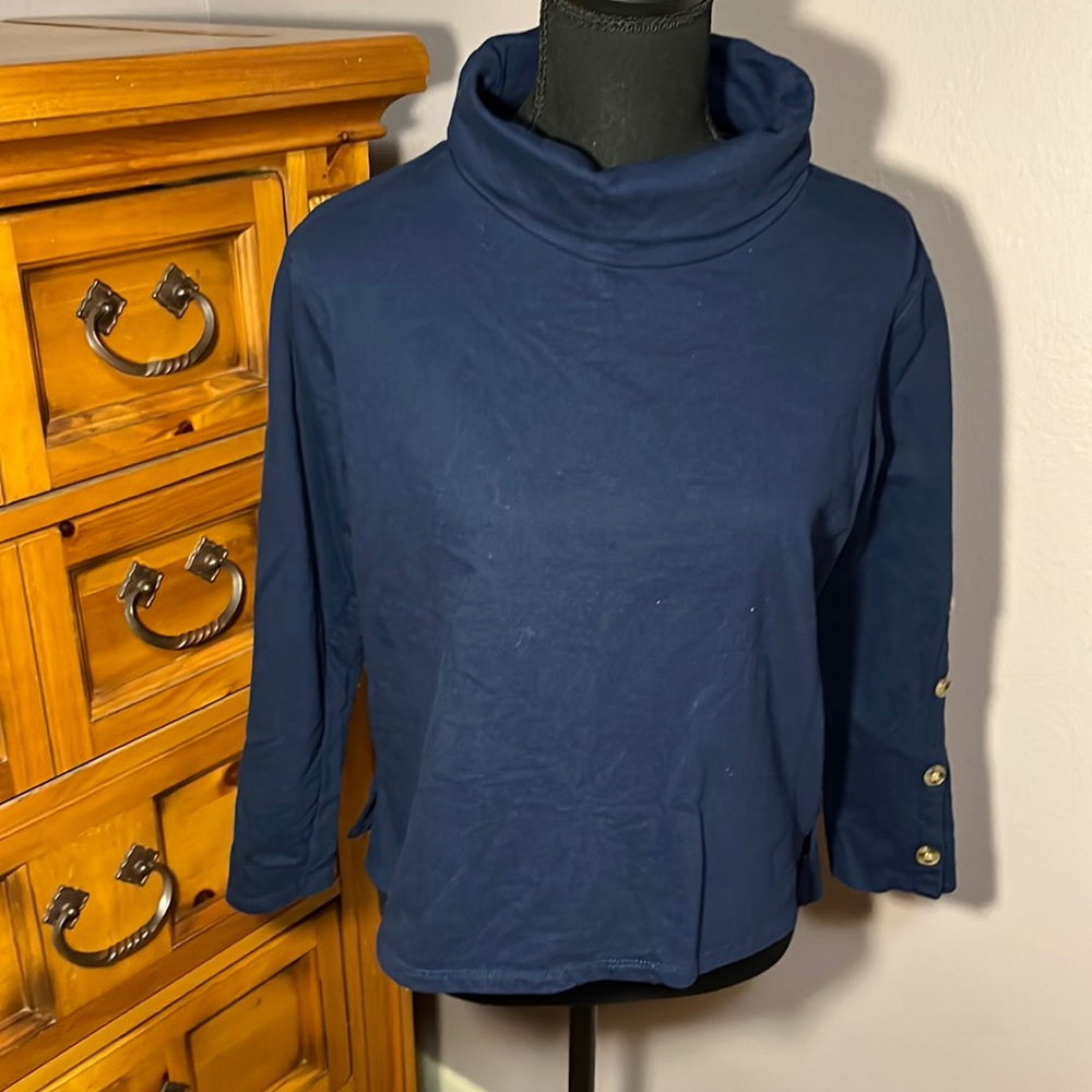 Dark blue turtle neck with brown sleeve buttons
